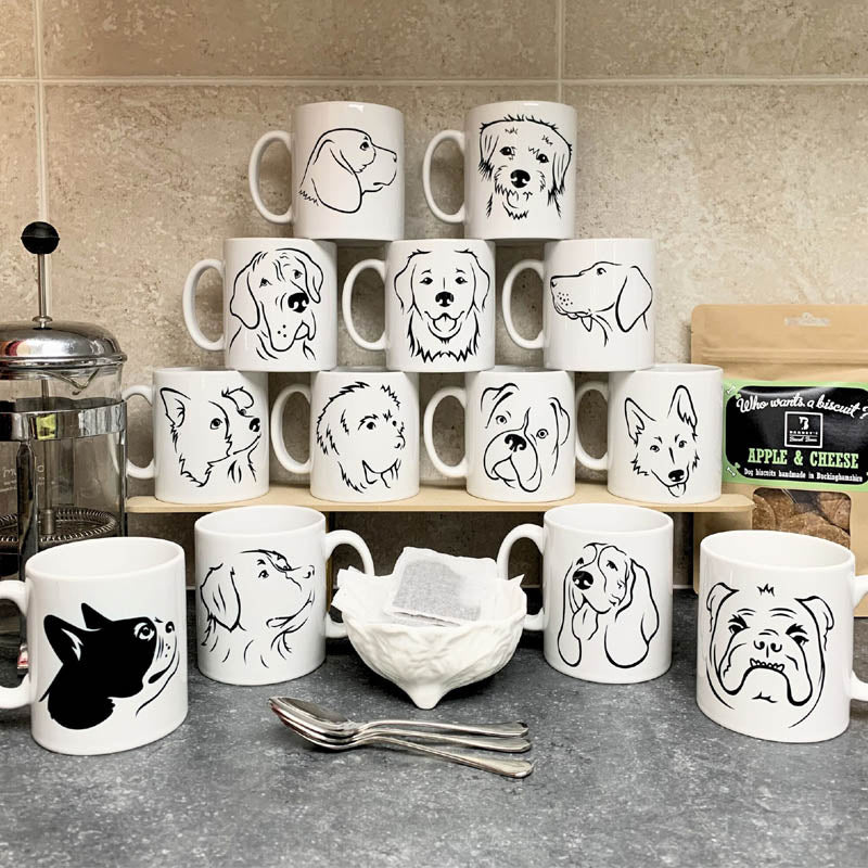 Selection of our illustrated dog mugs on a kitchen counter
